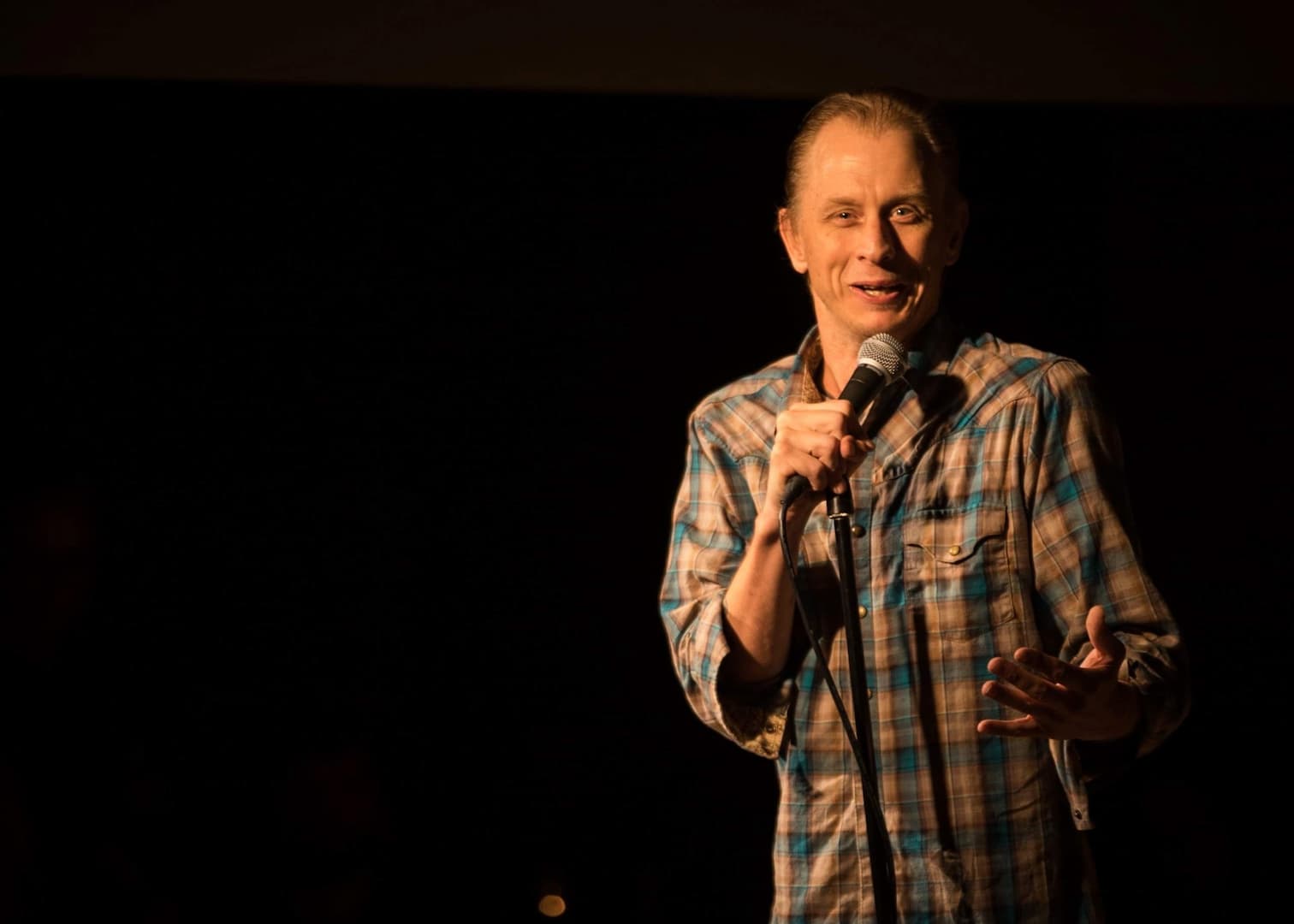 Davey Wester holding a microphone