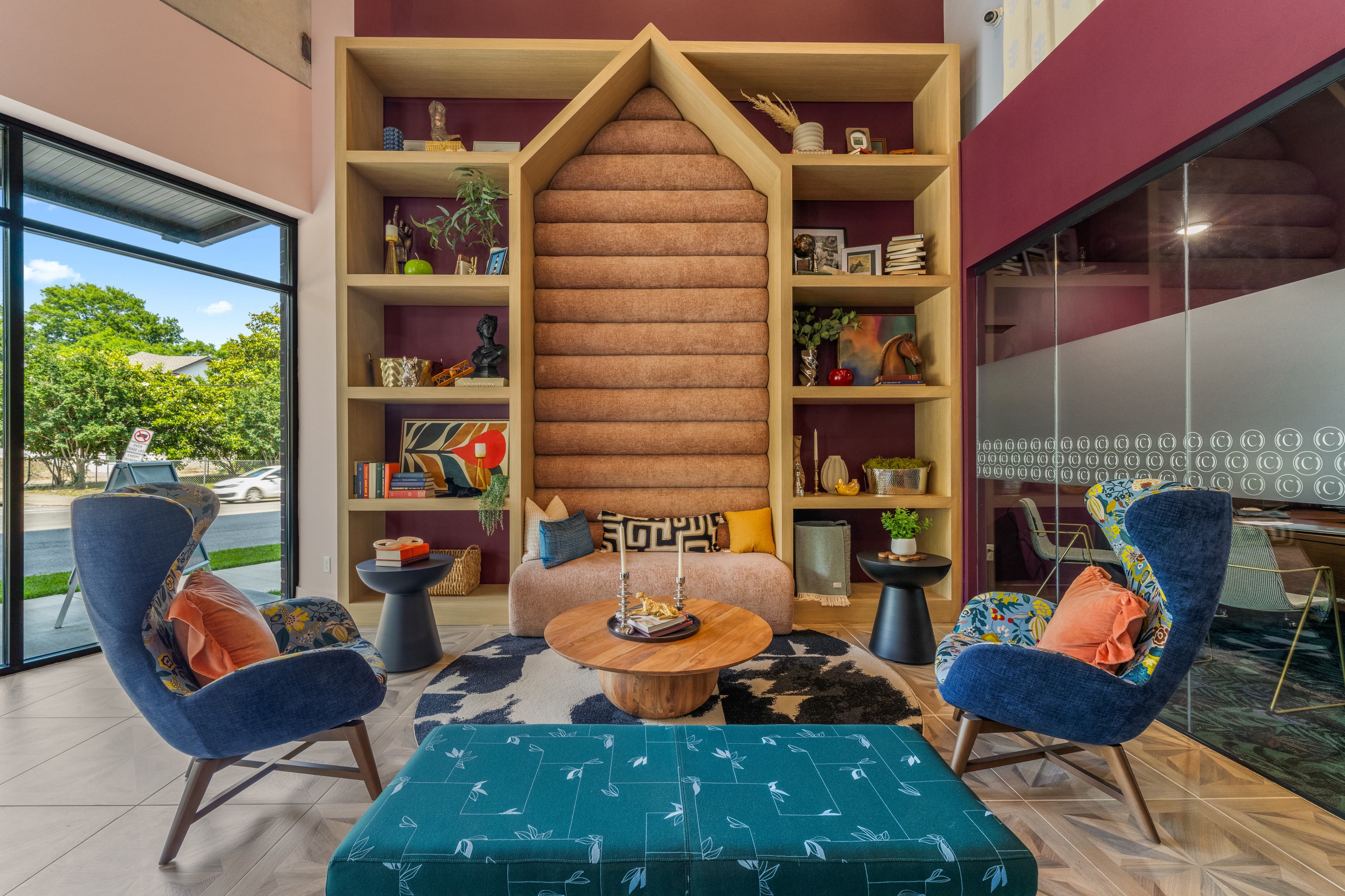 A spacious lobby lounge with stylish furniture, warm lighting, and a cozy ambiance for guests to enjoy.