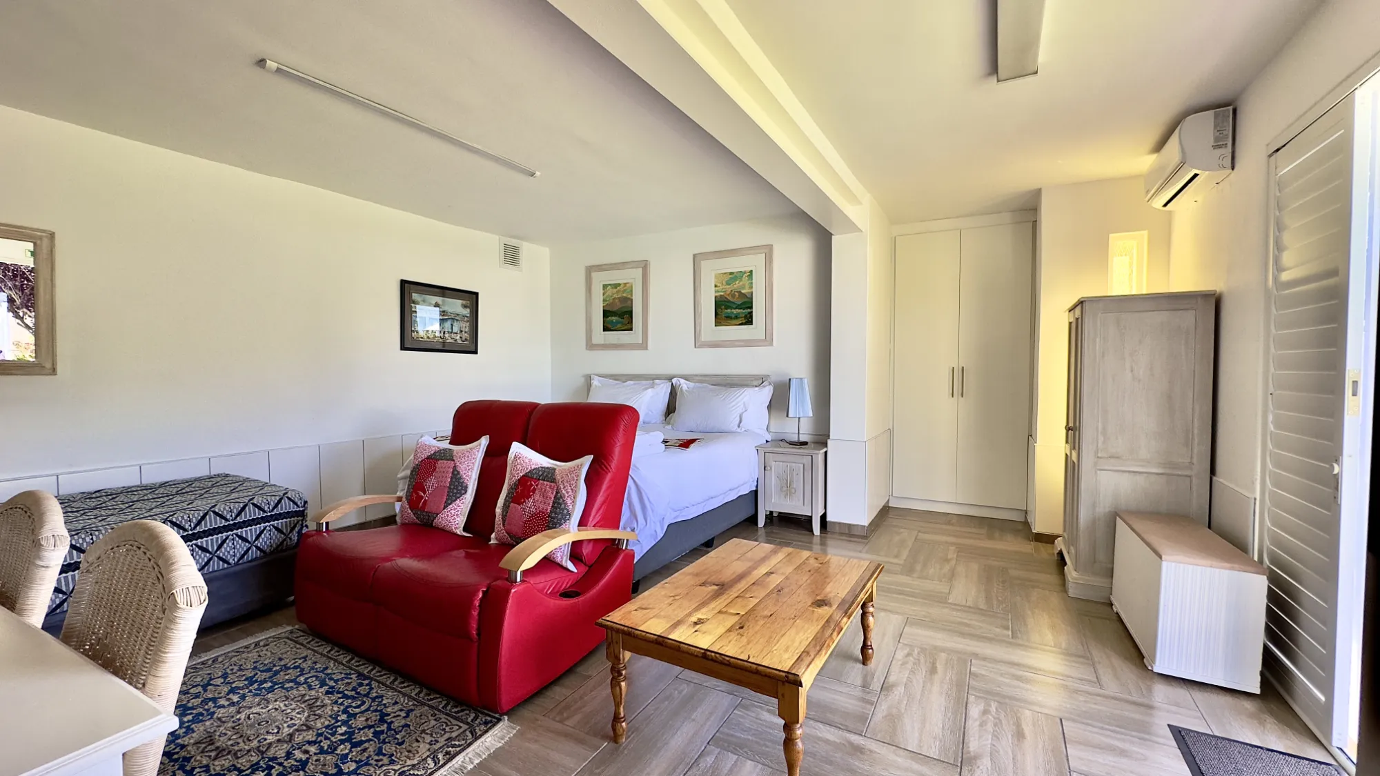 Wide view of the room towards the bed in our Take 5 room.