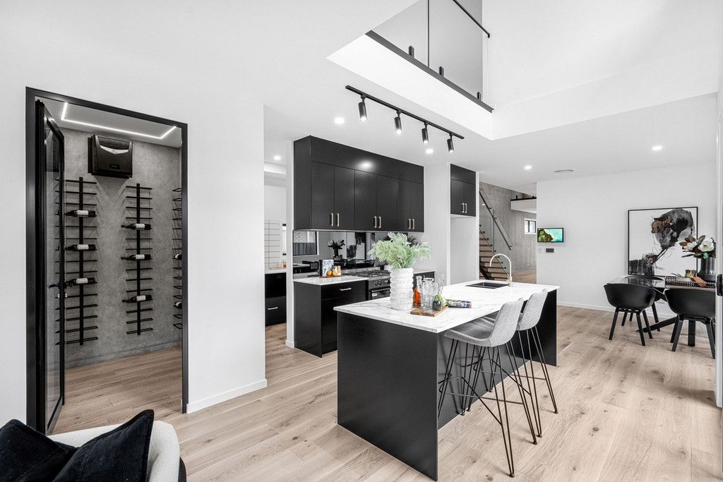 Contemporary Queensland kitchen with timber-look hybrid flooring, built to handle spills and stains while staying easy to clean in everyday use.