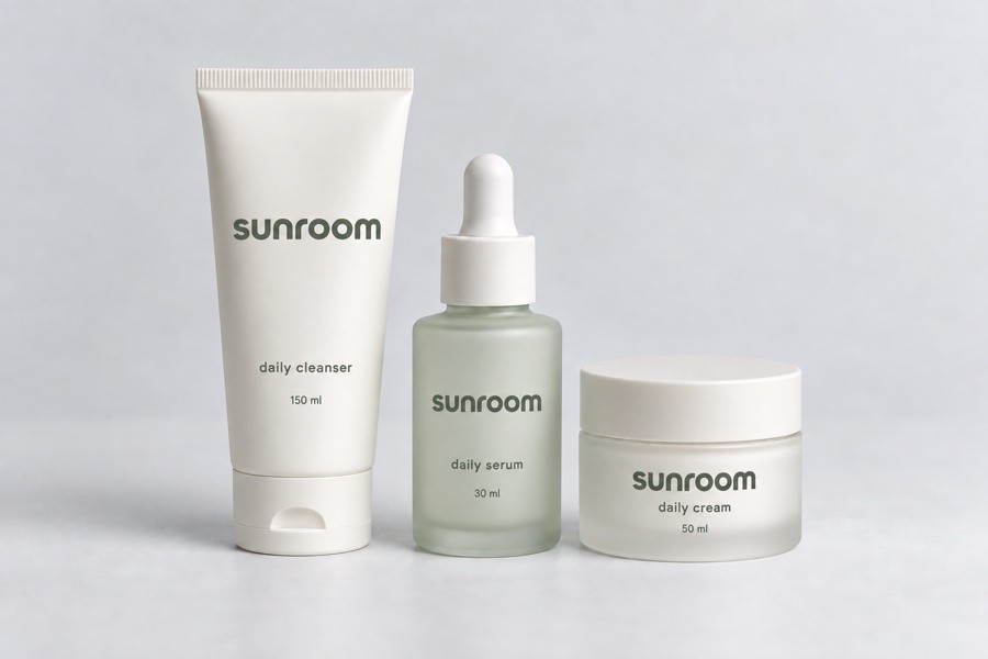 Sunroom-branded skincare essentials in ivory and pale sage