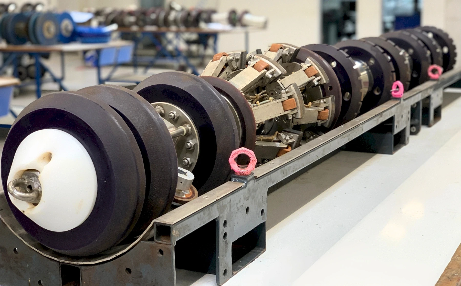 Inspection machine for pipes with wheels and sensors, for industrial pipeline inspection.