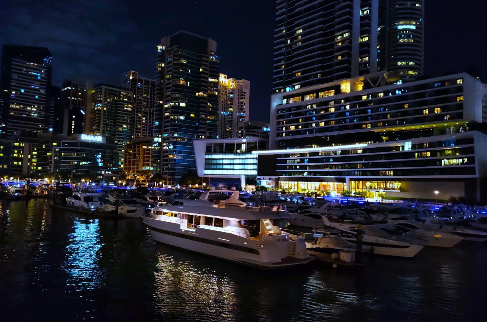 Night view of a yacht cruise during nighttime in Dubai. 