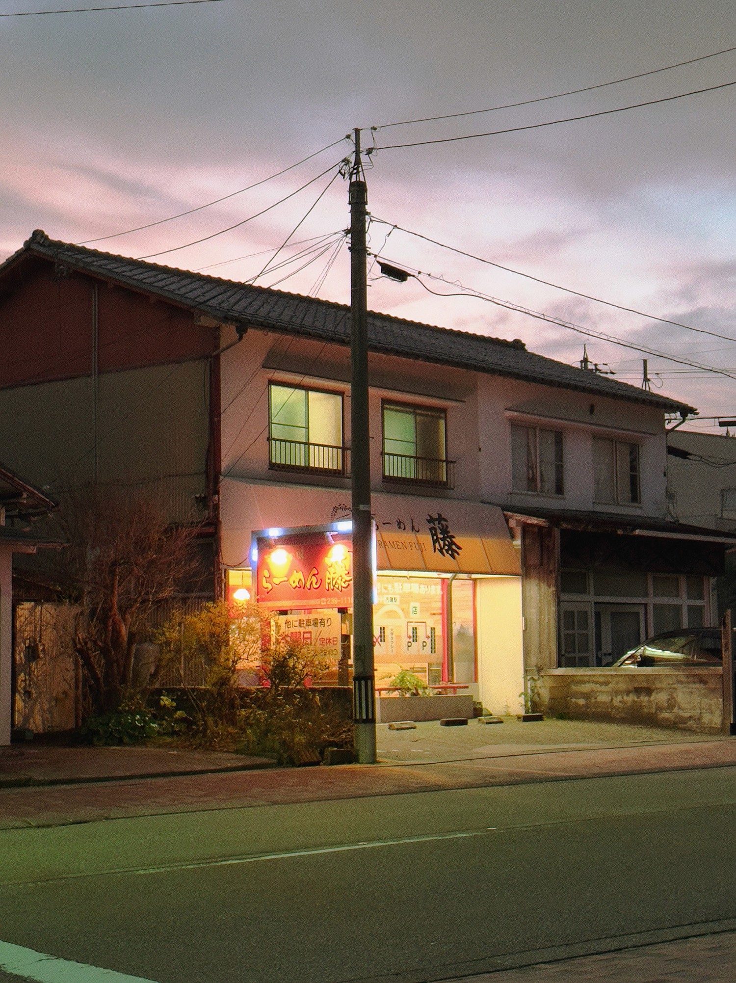 Ramen Restaurent in moody Japan sky photo under telephone wires
