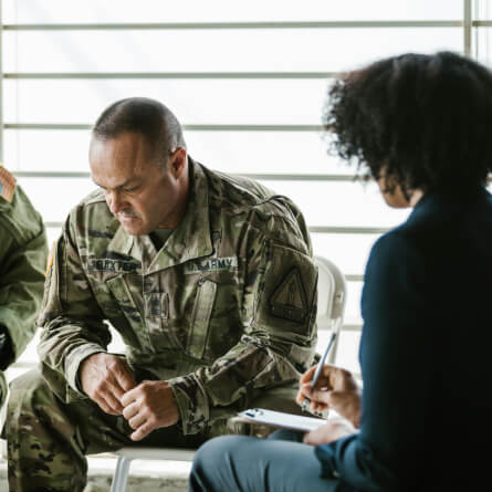 A soldier listening to a therapist