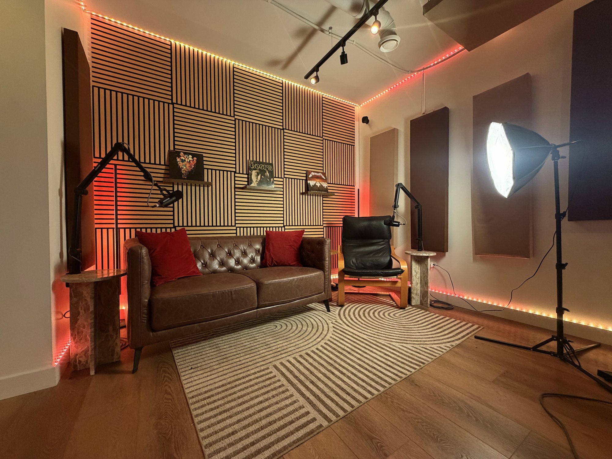Modern music production workstation with dual displays, studio monitors, and analog hardware in Calgary, Alberta.