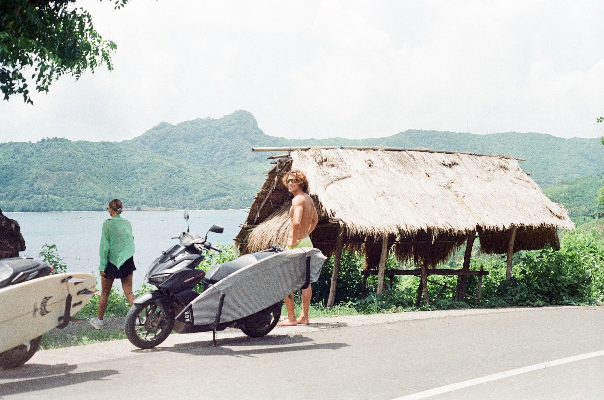 film photo of the surfers looking for the waves in Sumbawa