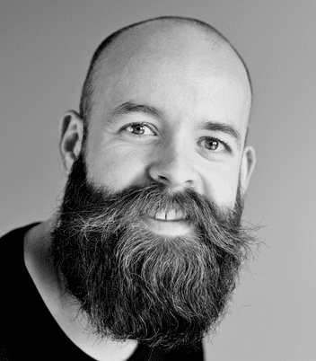 grayscale photography of man wearing crew-neck shirt