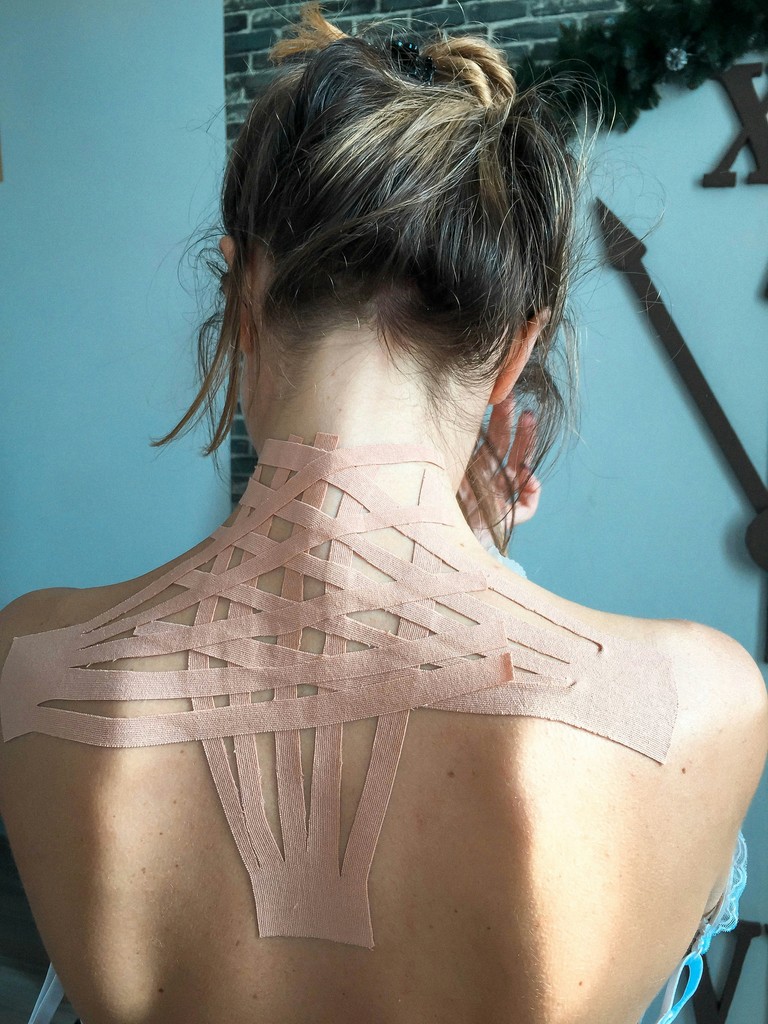 a woman with tapings on her back