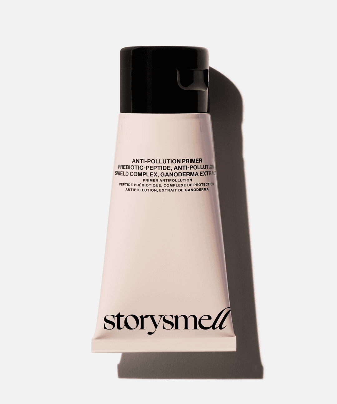 A bottle of body cream with the logo of Storysmell perfume studio