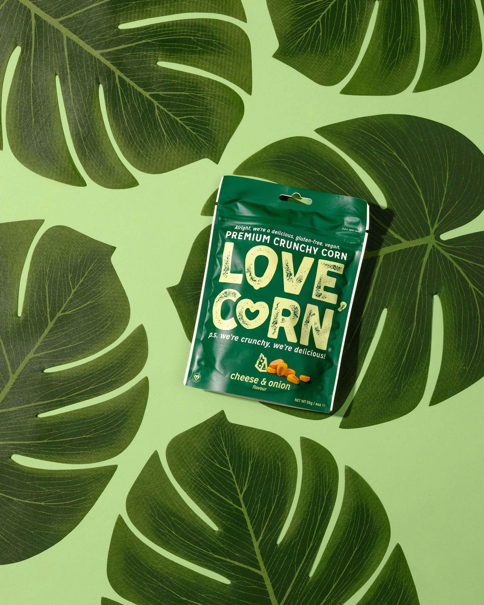 blue and green plastic pack of love corn on big green leaves