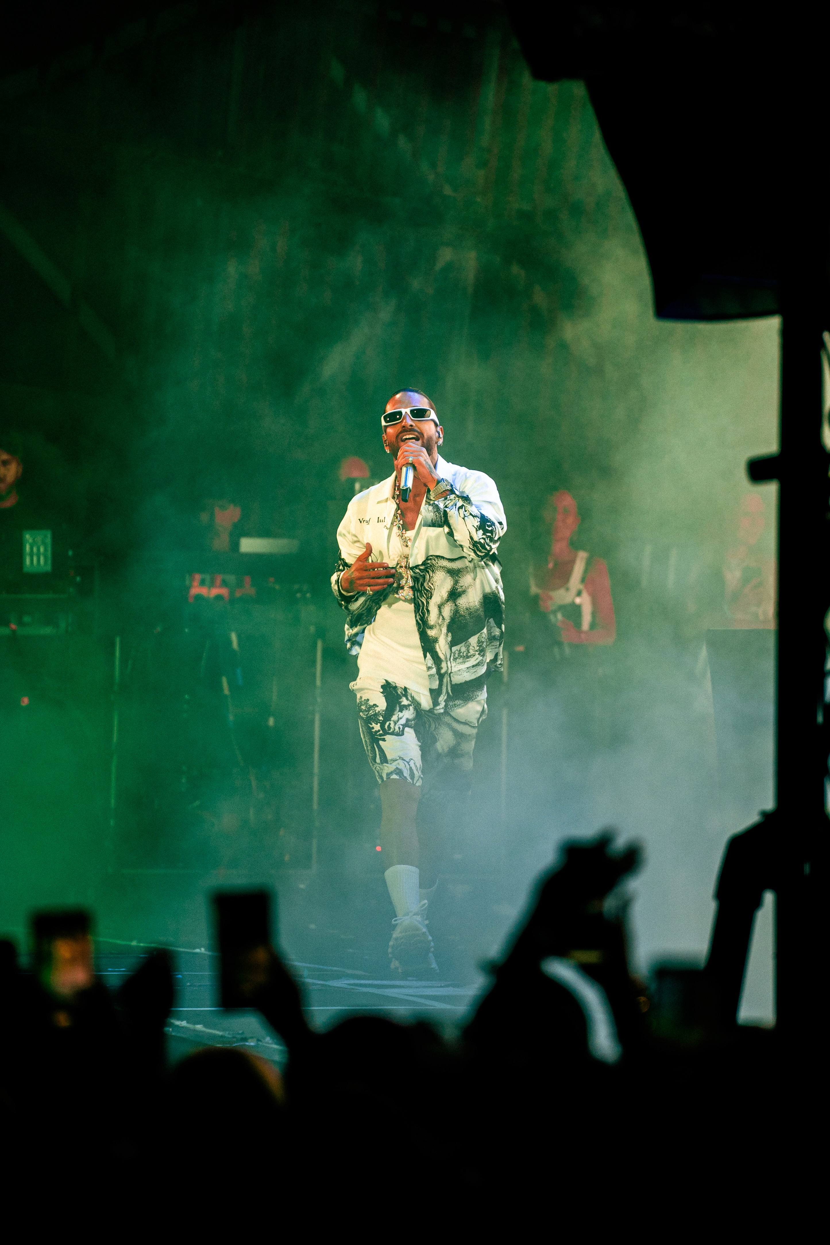  A woman in a helmet with a light trail, suggesting movement or speed in a dynamic outdoor setting.