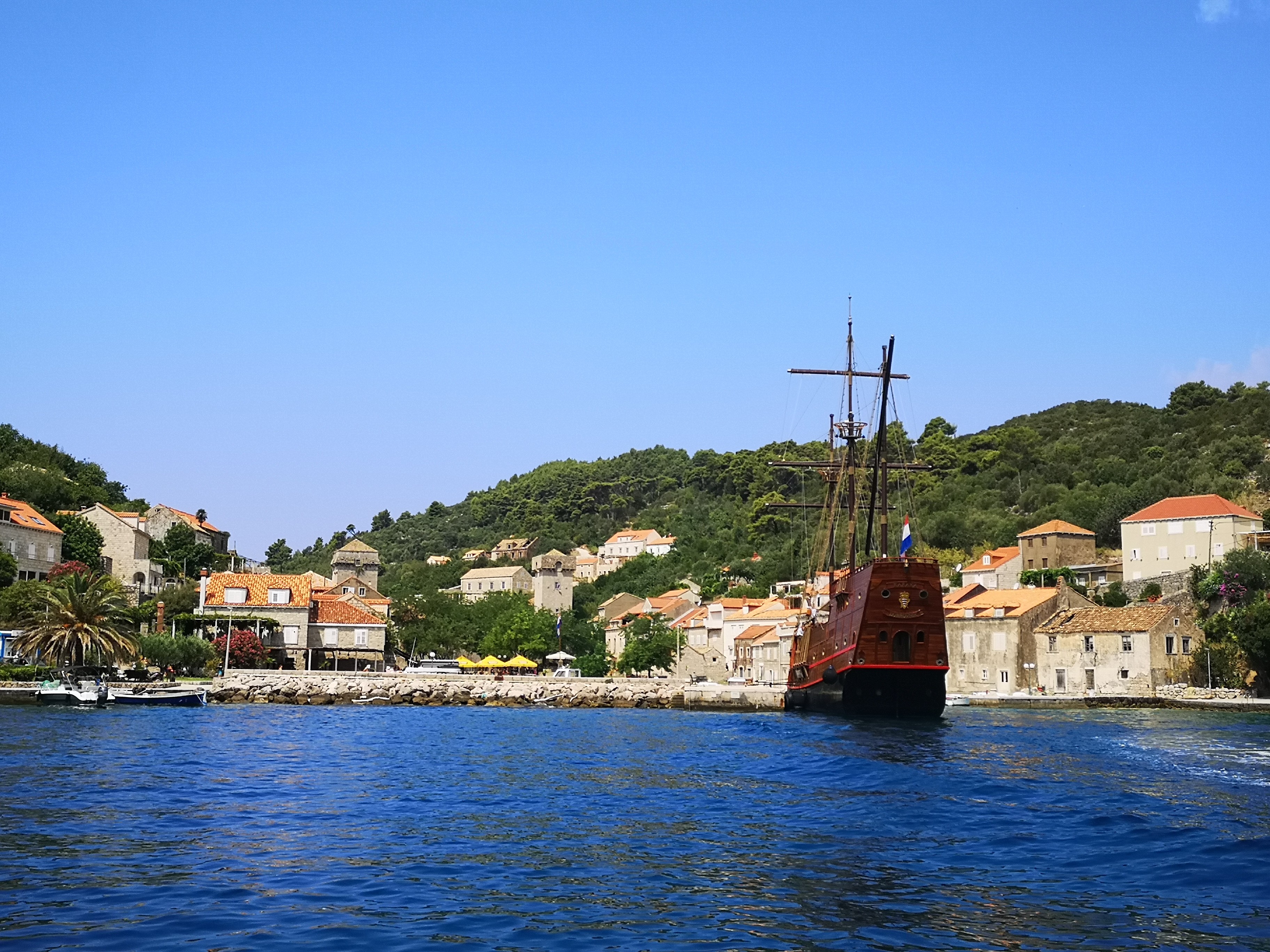 Historic Šipan island stone houses and quiet harbor on a boat trip from Dubrovnik