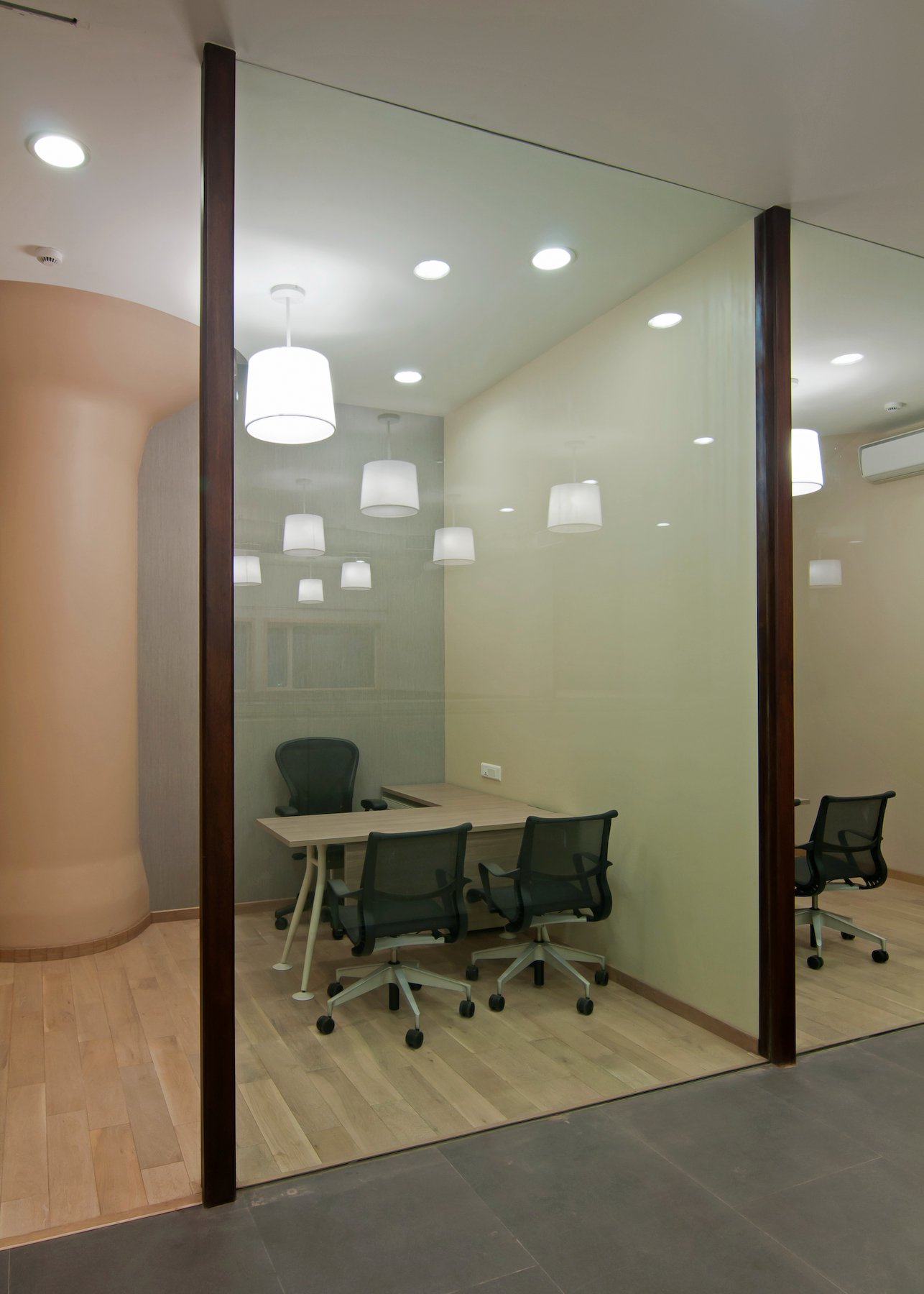 corporate office interior with meeting room and glass partitions