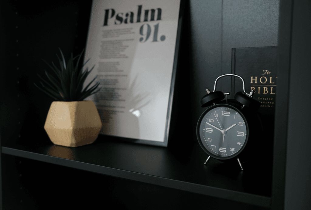 a view of a valley with trees and hills in the background
