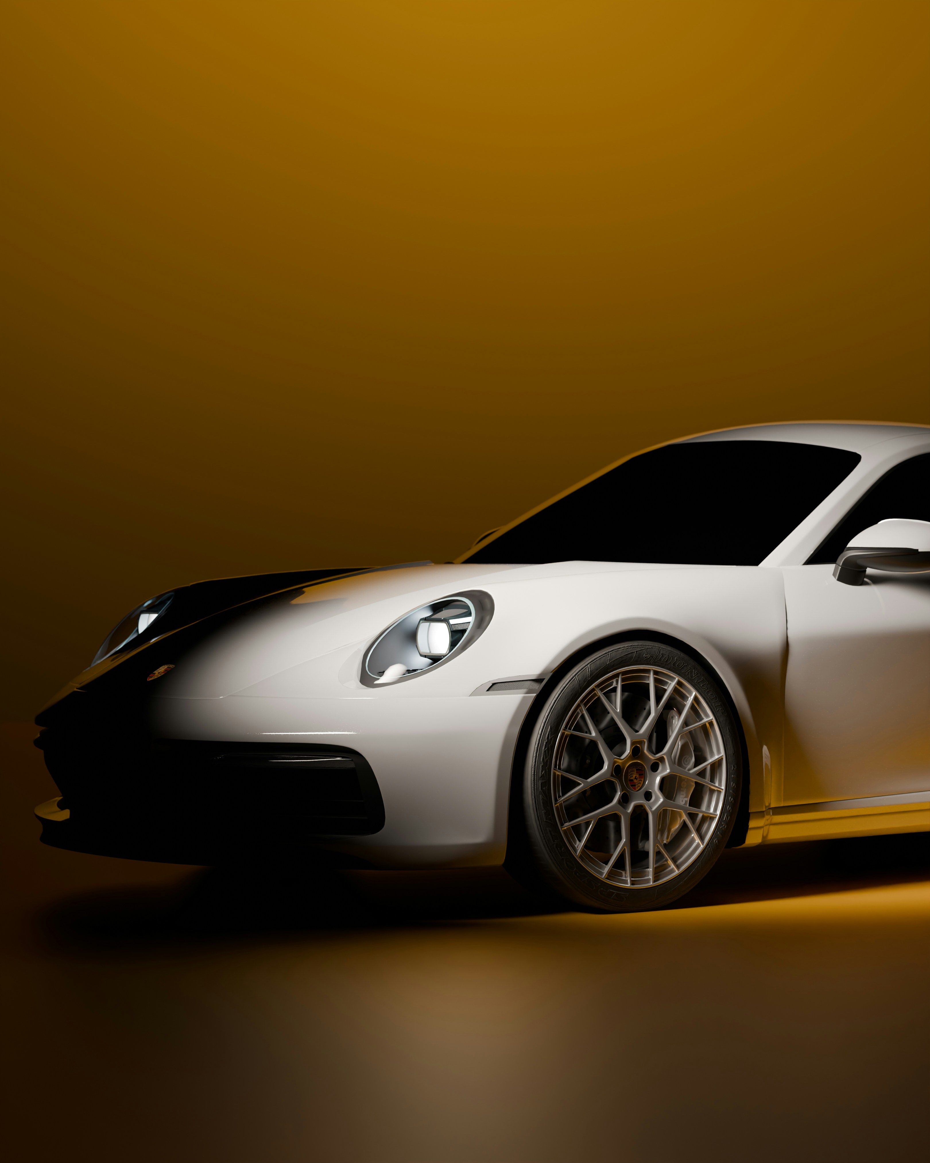 A white sports car with detailed rims.