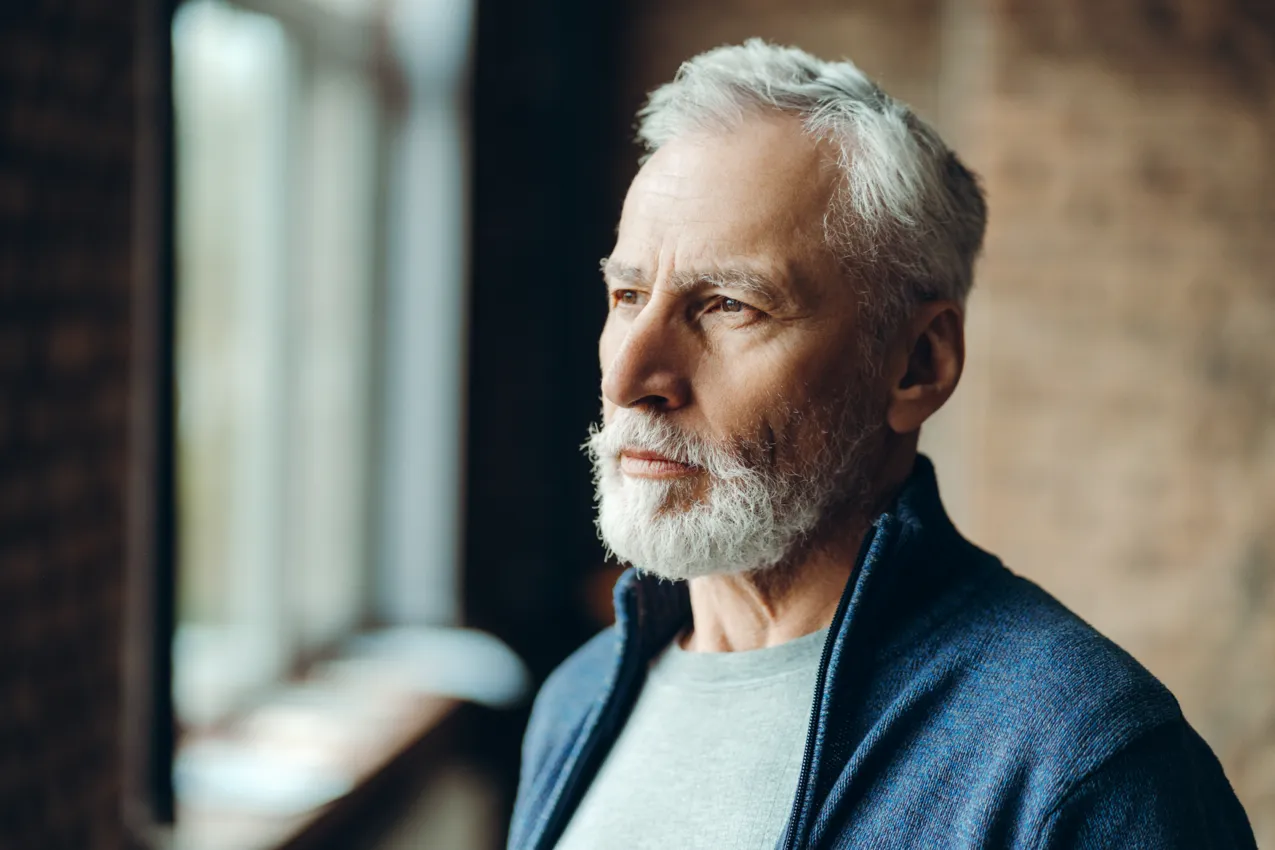 older man looking out to distance