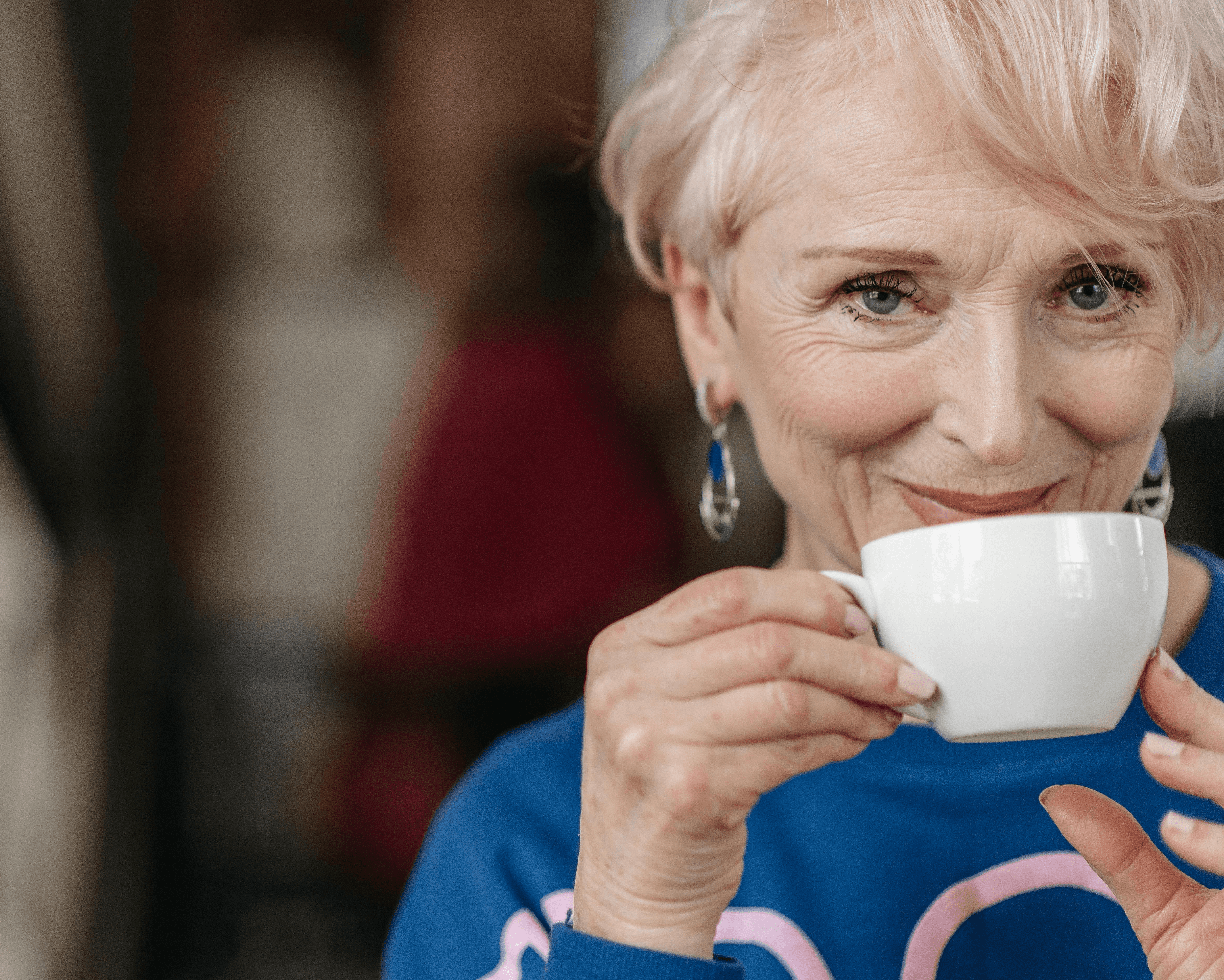 A girl walks to a cabin in nature.