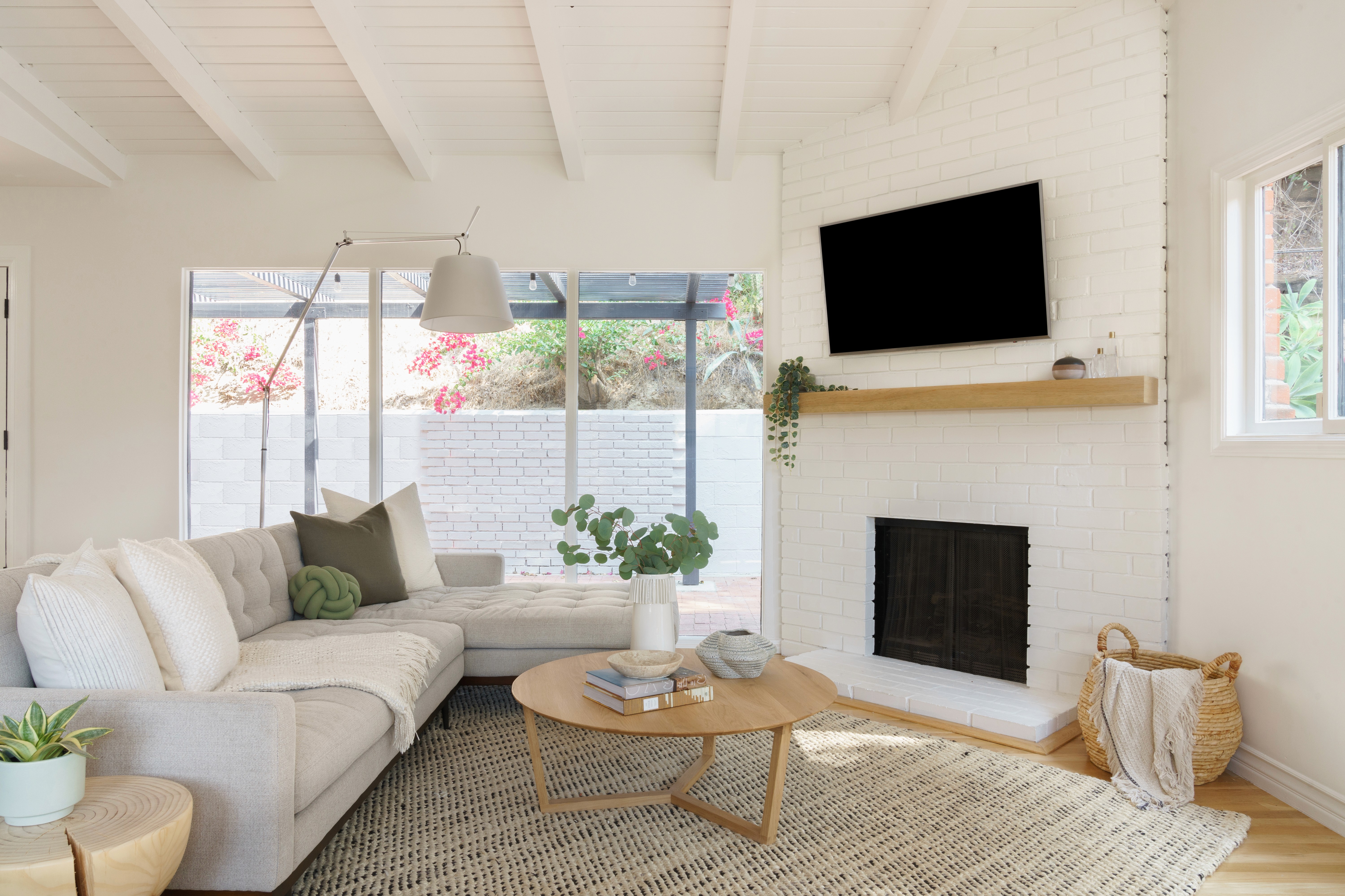 Mid-century living room refresh with a blend of classic design and contemporary comfort  by Ventura & Los Angeles interior designer Jubilee Interiors