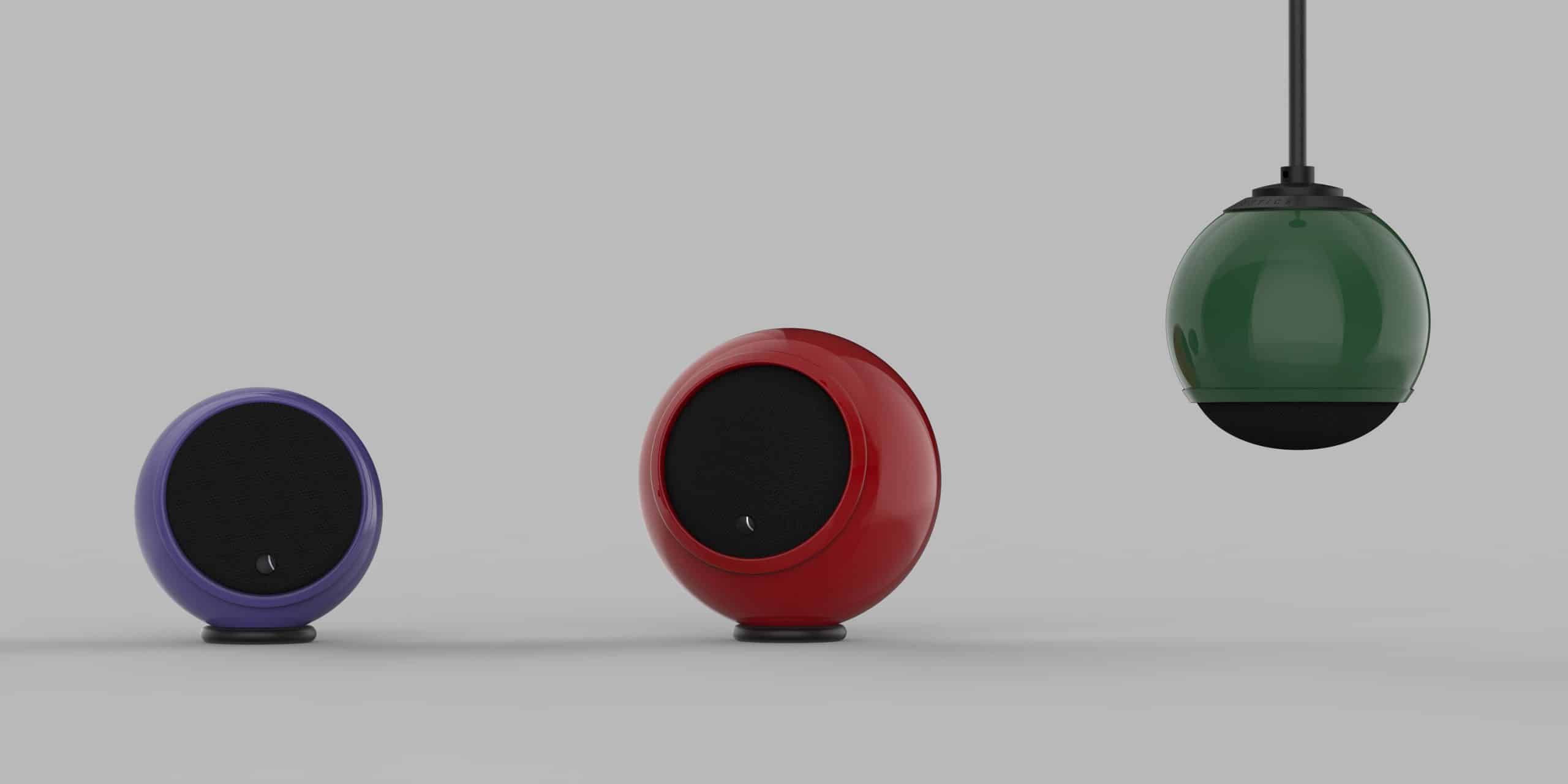 Three spherical speakers in purple, red, and green.