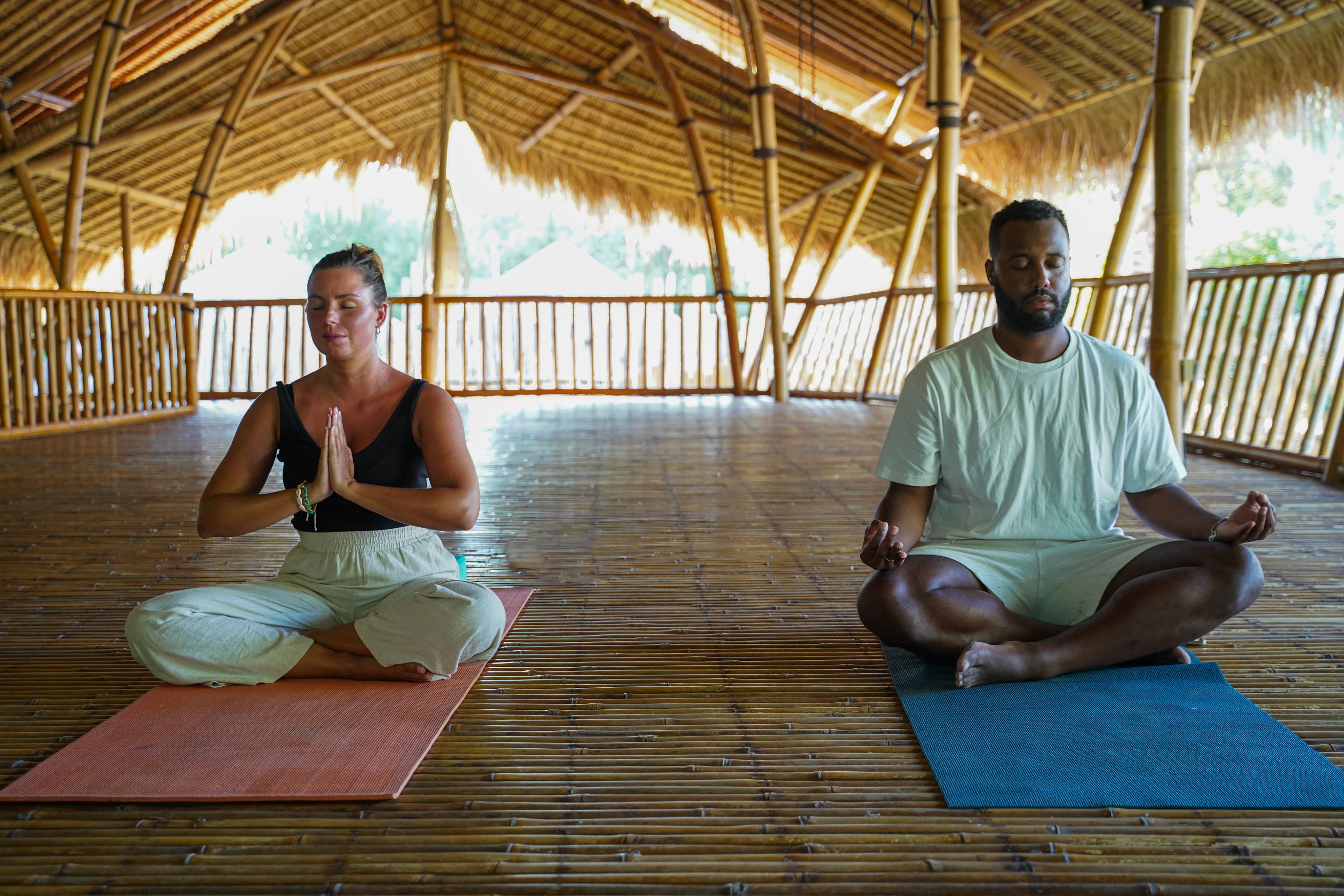 Two people doing yoga