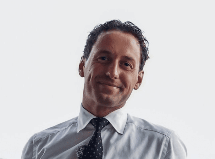 Headshot of *Designer Name*