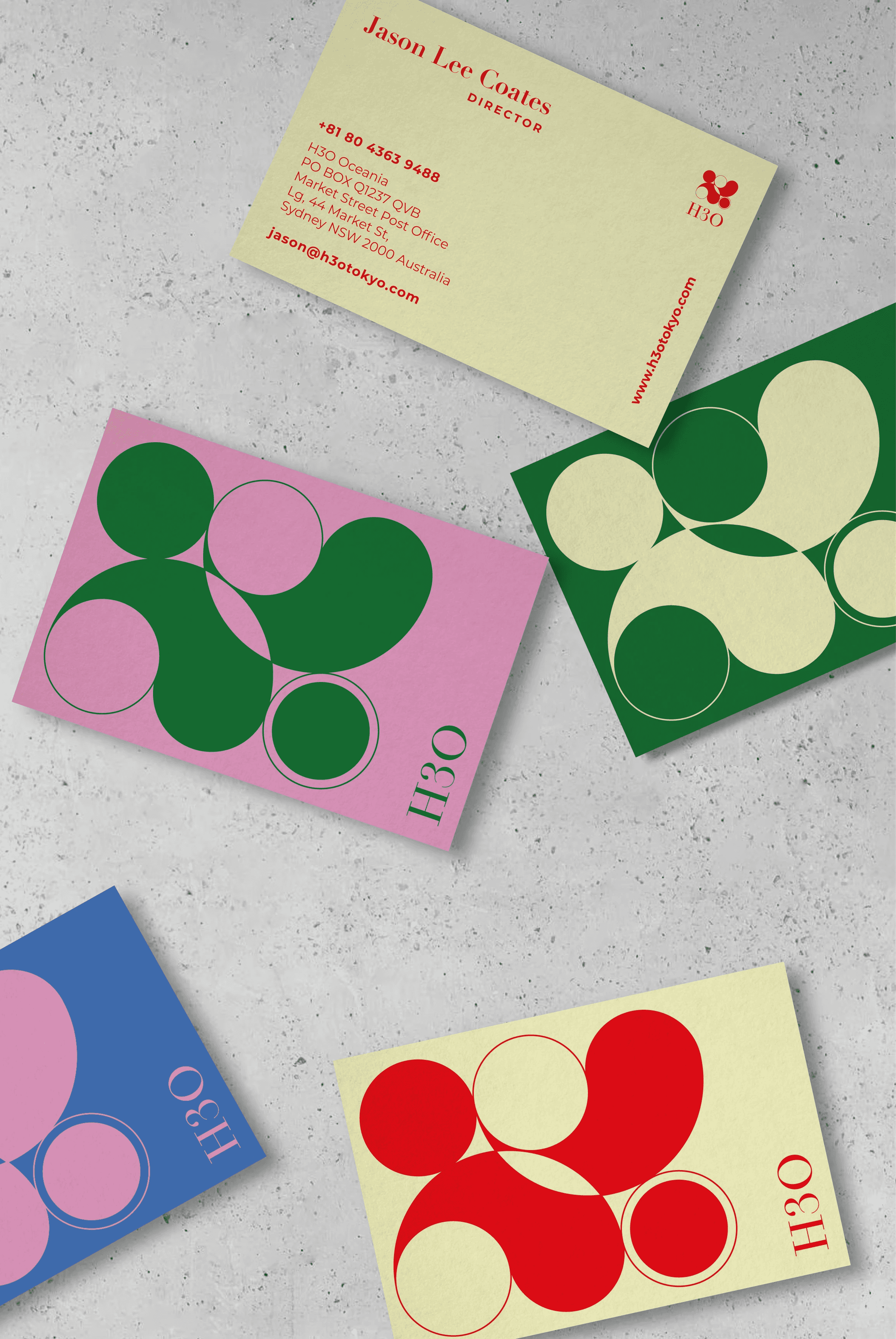 H3O stationery and business cards showcasing the colorful circular branding system.