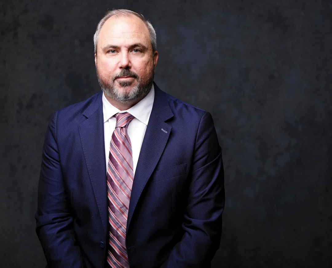 Two Men Using Laptop