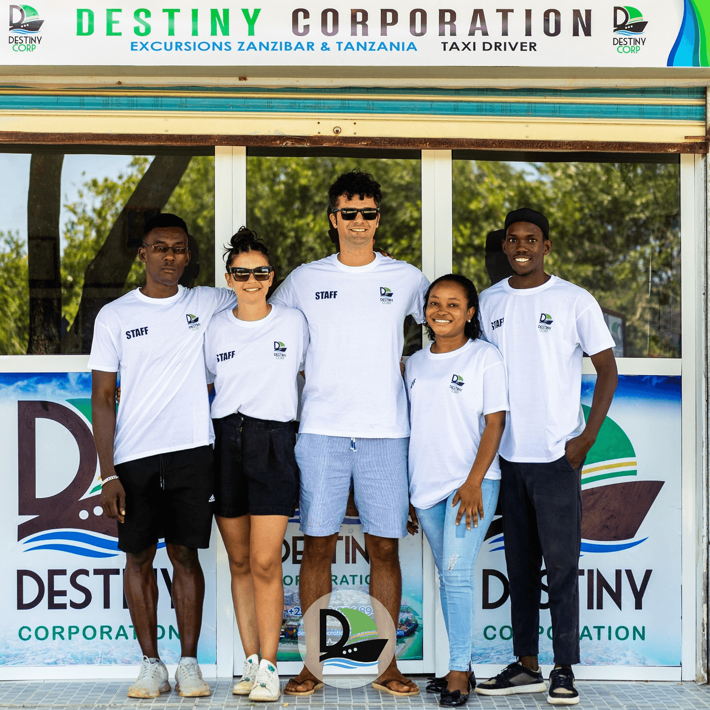 Traveler walking across golden dunes in AlUla desert under clear blue sky.
