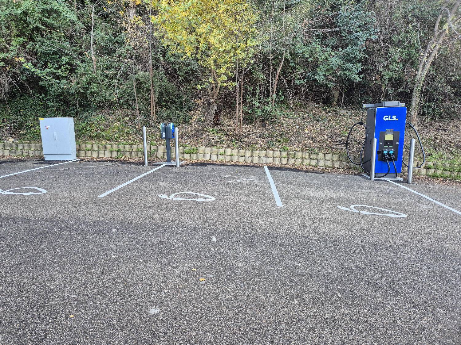 a man pumping gas into his car at a gas station