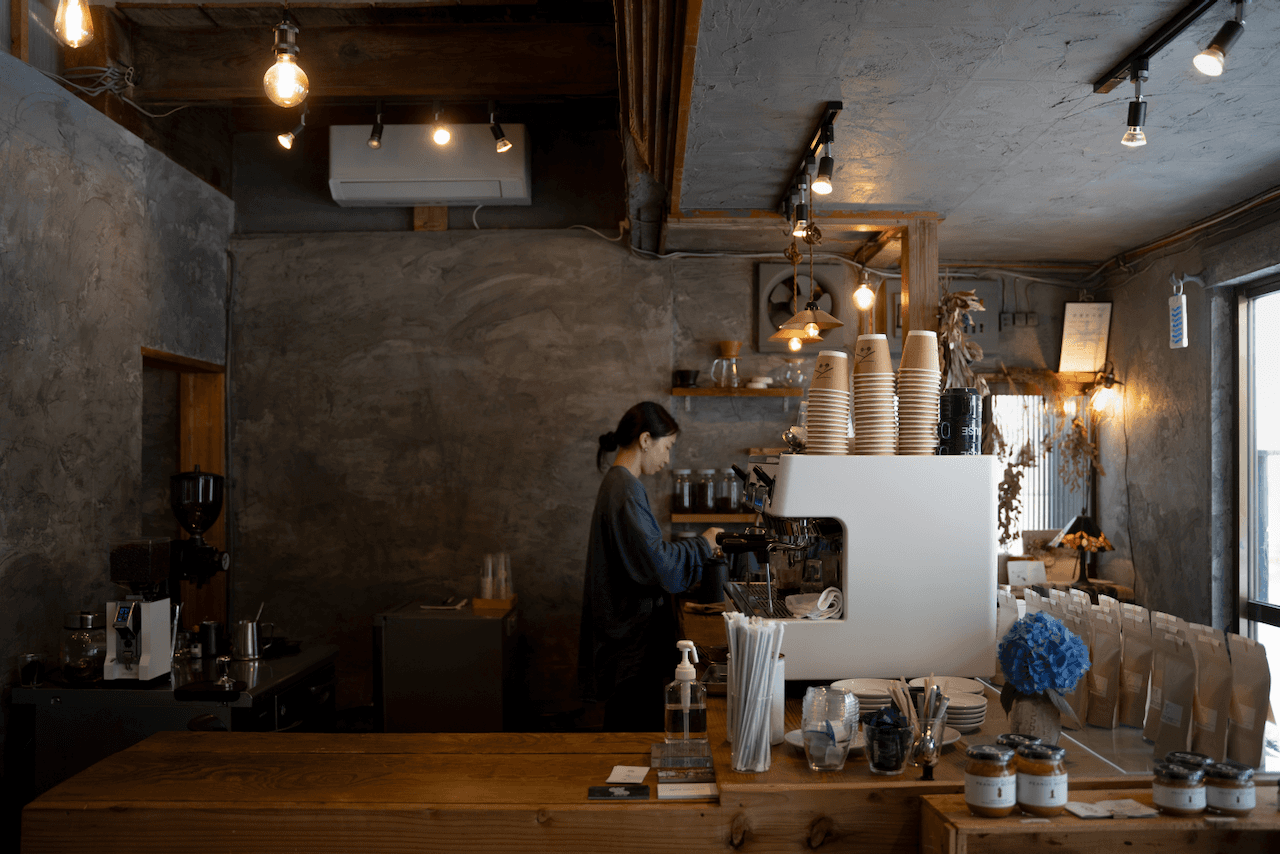 Interior of SPAiCE Coffee House showing a barista making coffee
