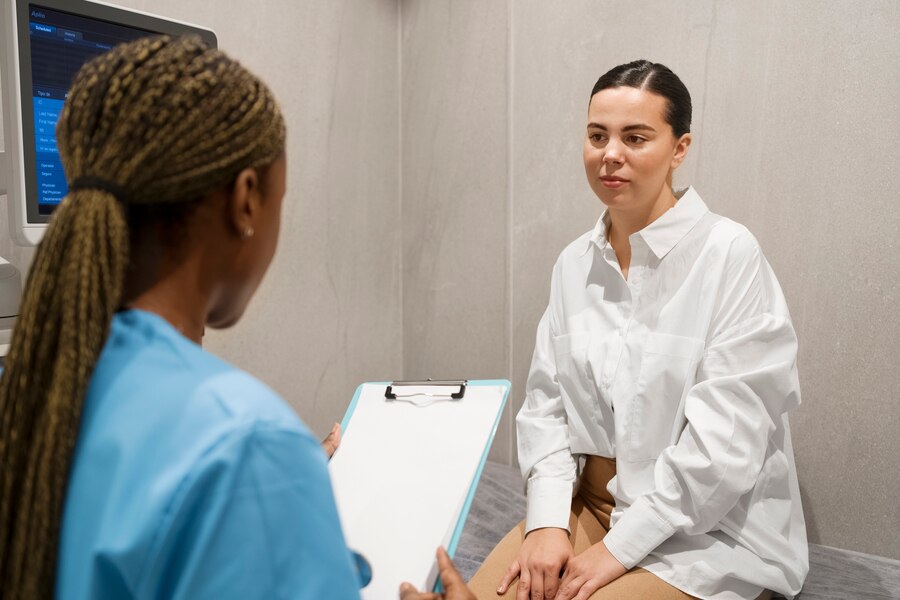 A nurse dong a regular checkup of her patient.