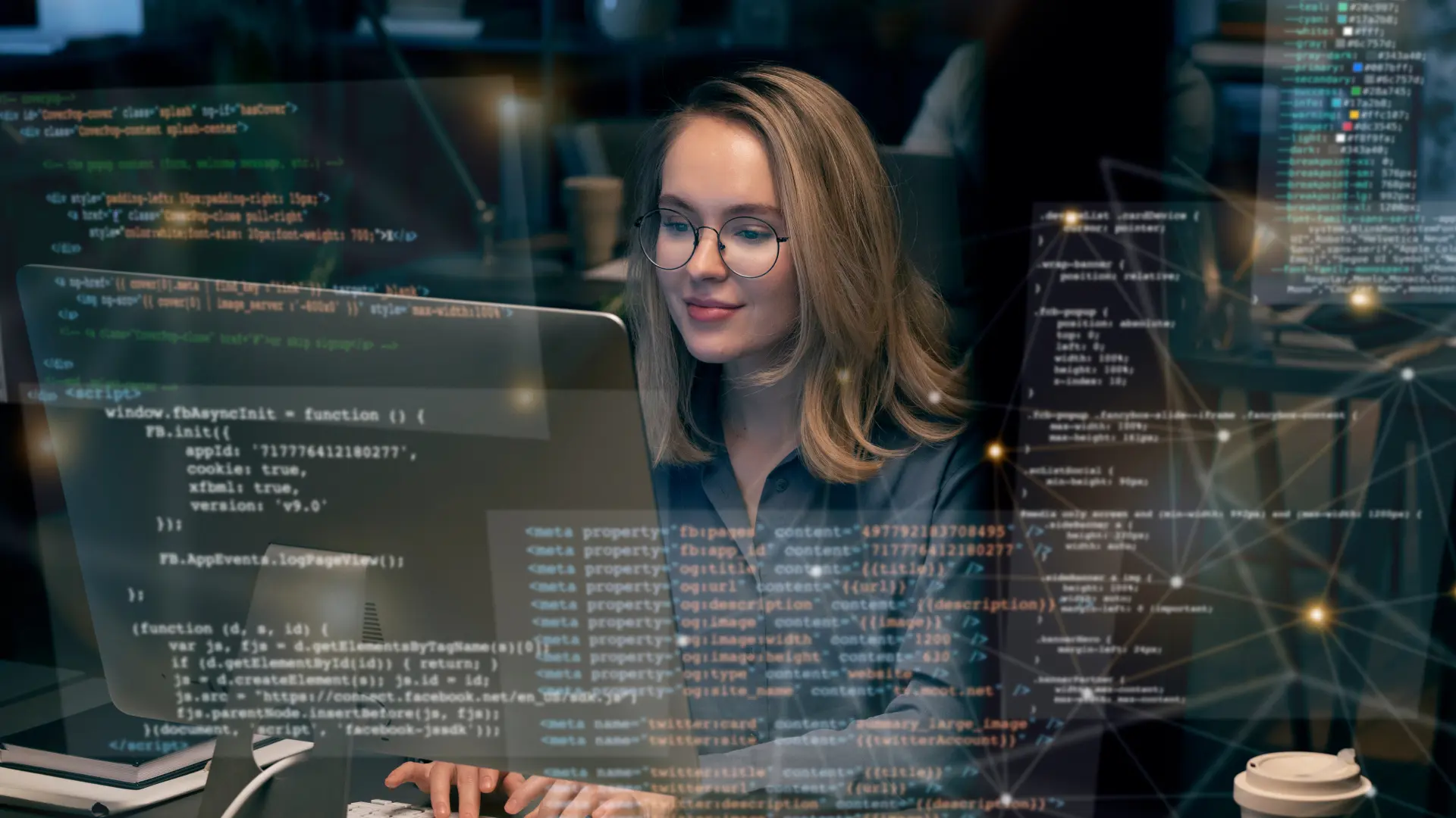 A person is working on a computer in a dimly lit office with multiple screens displaying complex lines of code, symbolizing a focus on European Master Data Science.