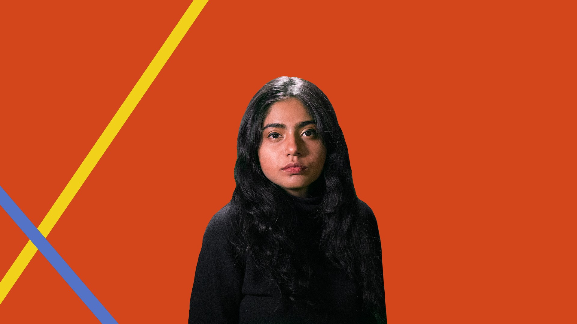 A young woman with long dark hair stands against a solid orange background. She wears a black top and looks directly at the camera with a neutral expression. Two diagonal yellow and blue lines are visible behind her.