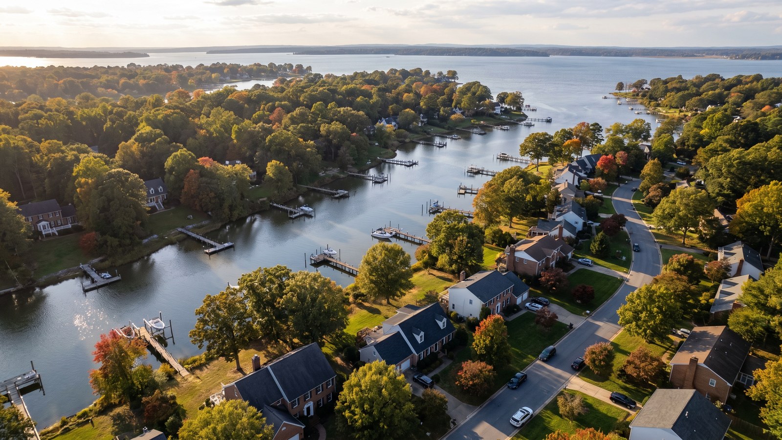 Aerial view of a waterfront neighborhood with private piers on a creek in Anne Arundel County, Maryland