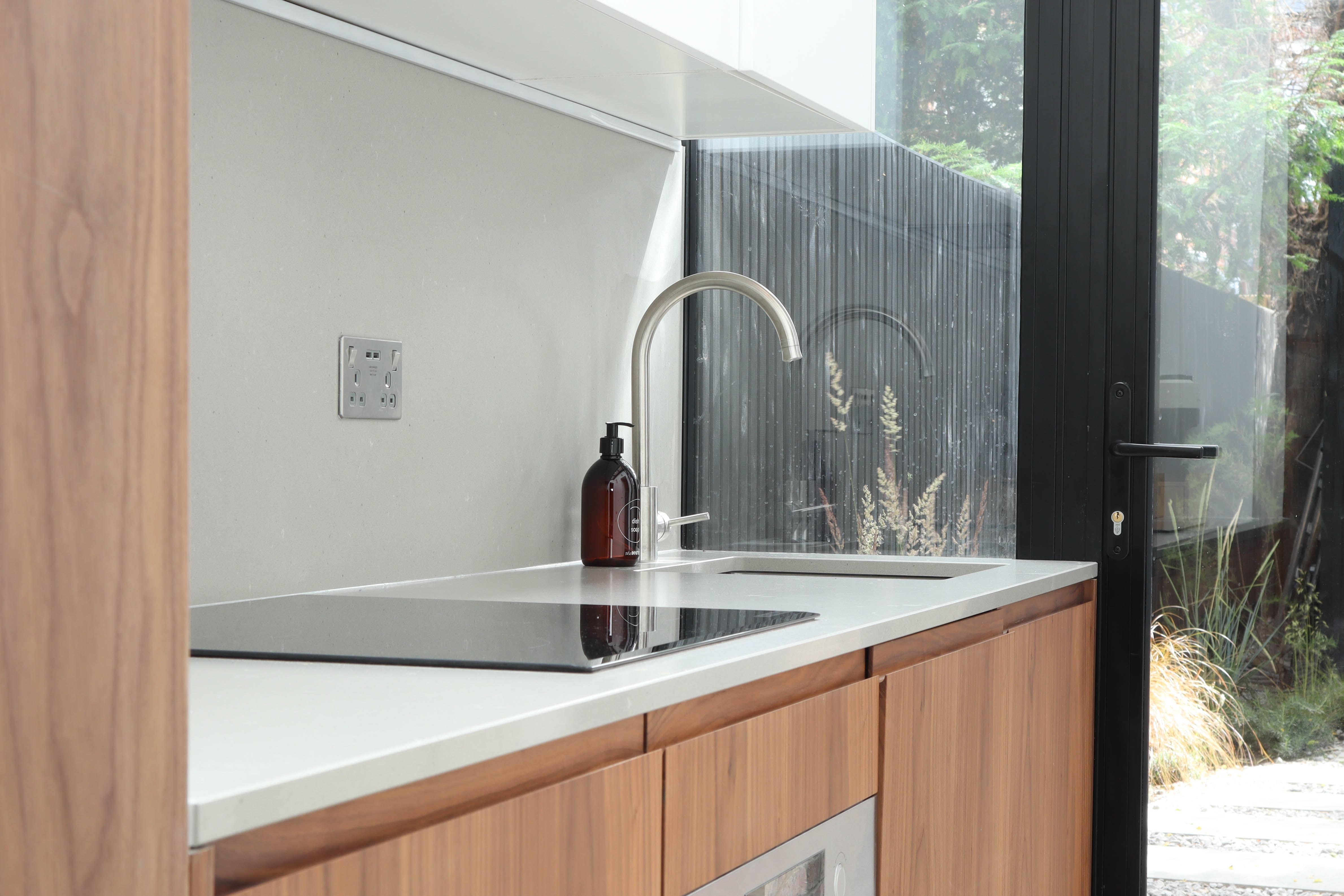 Nordic inspired architectural kitchen with large window and natural light