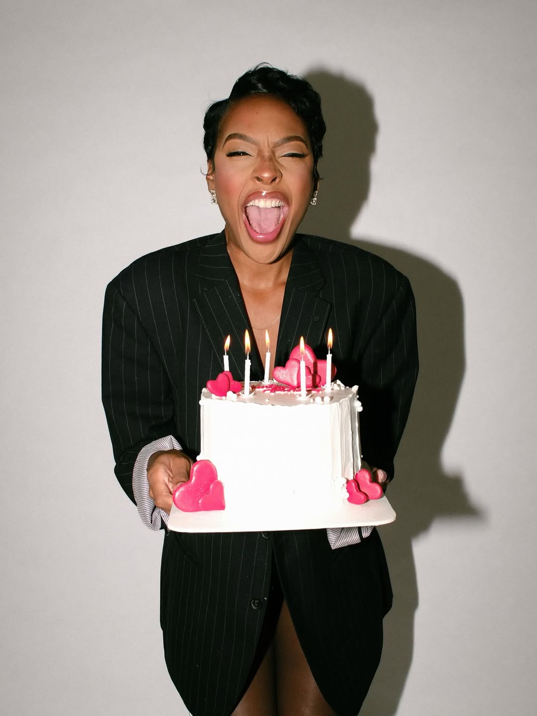 Happy woman with her birthday cake