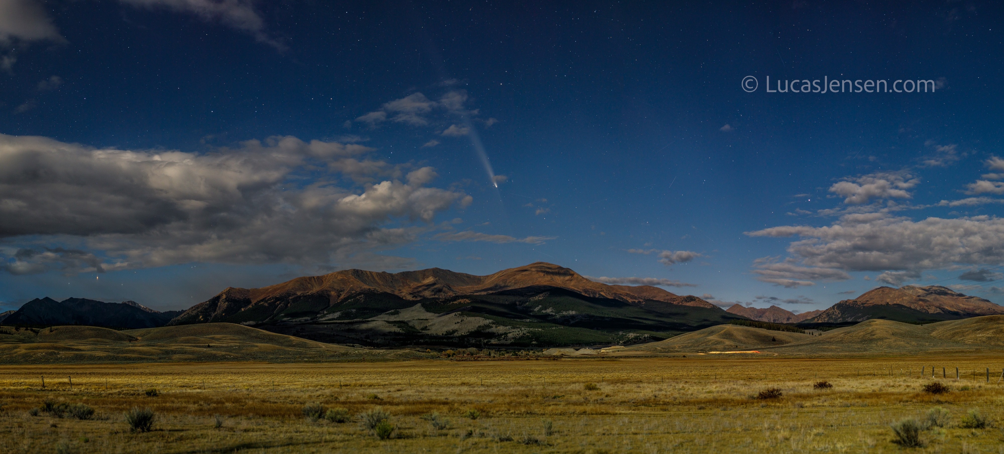Panoramic landscape photograph of mountains, water, desert, or coast by Lucas Jensen