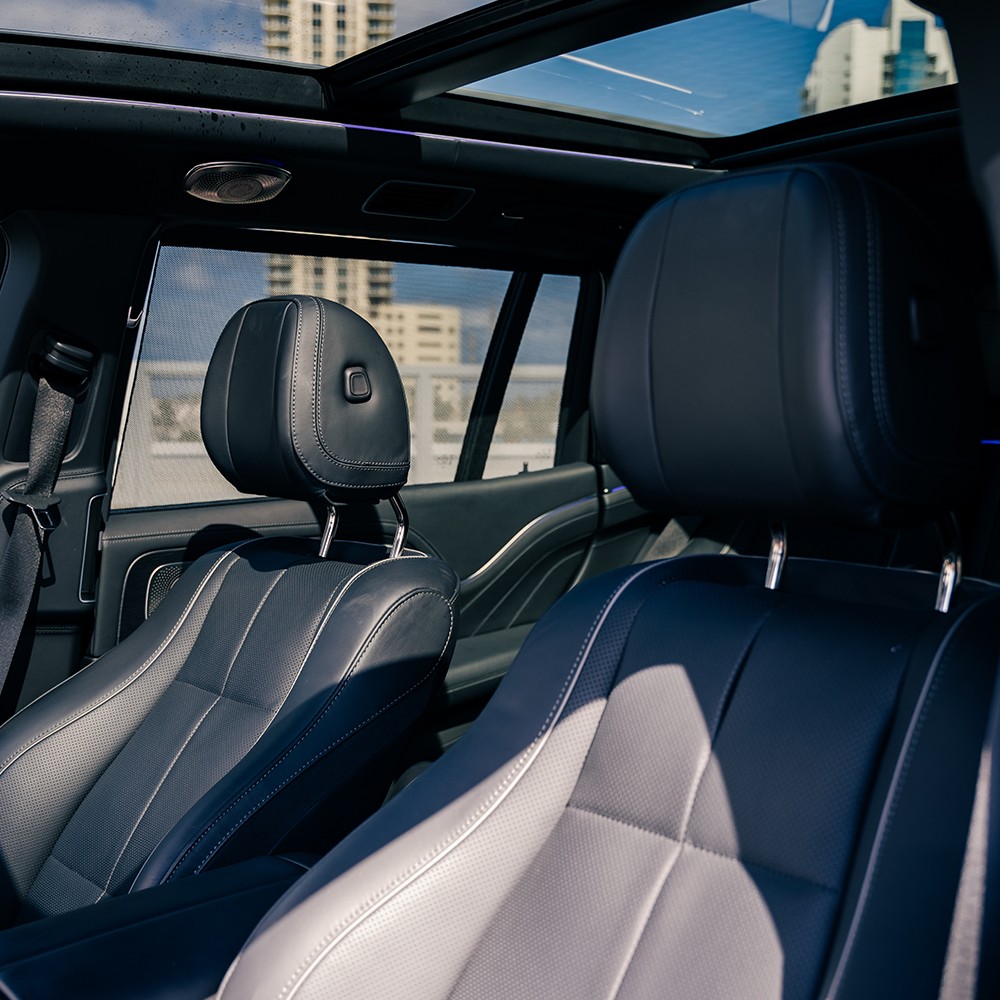 Luxurious front interior of the Mercedes-Maybach GLS 600, featuring premium leather seats and sophisticated dashboard.