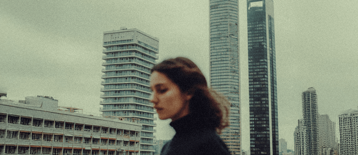 Out of focus woman in front of a city