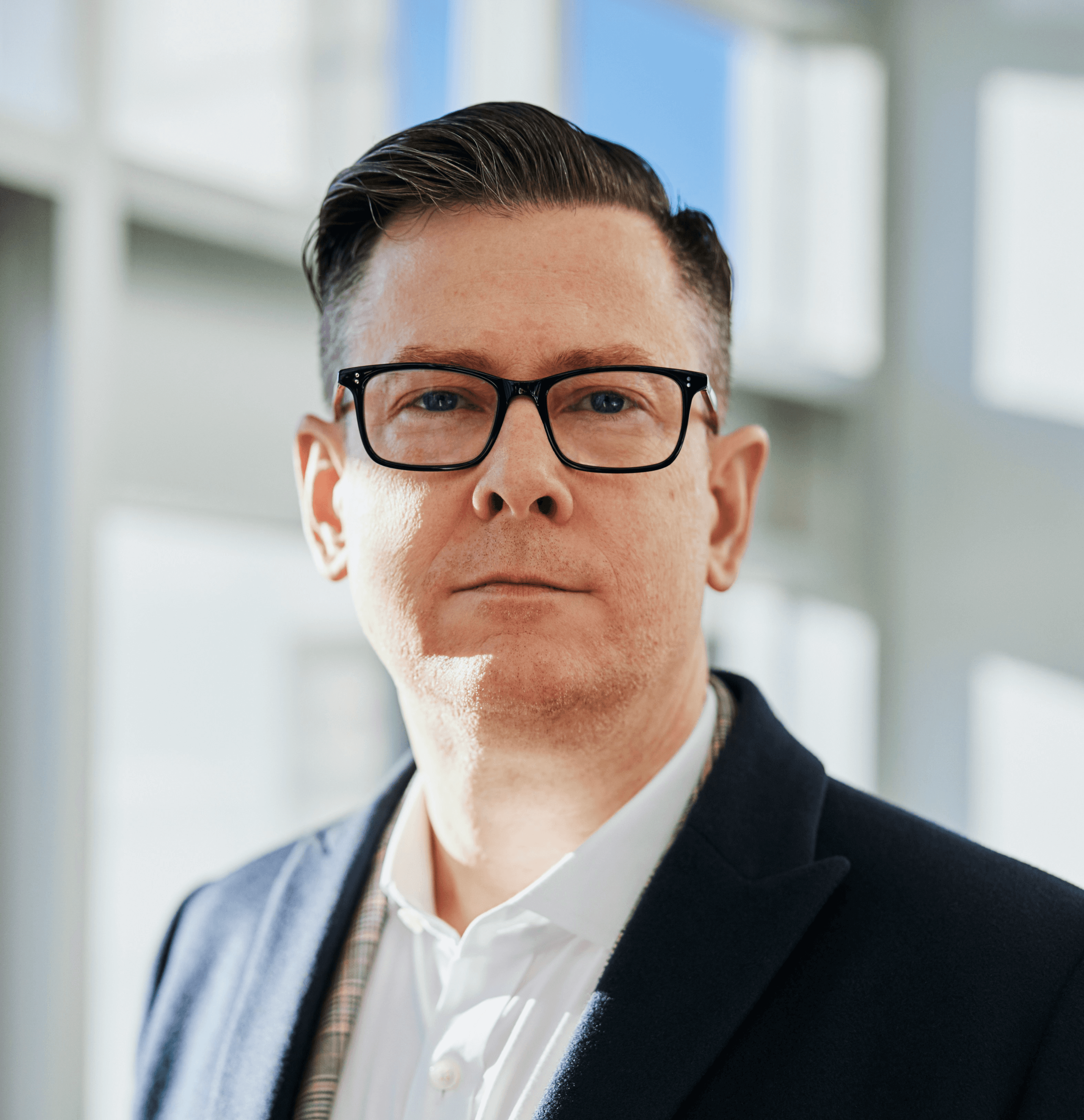 man standing beside wall