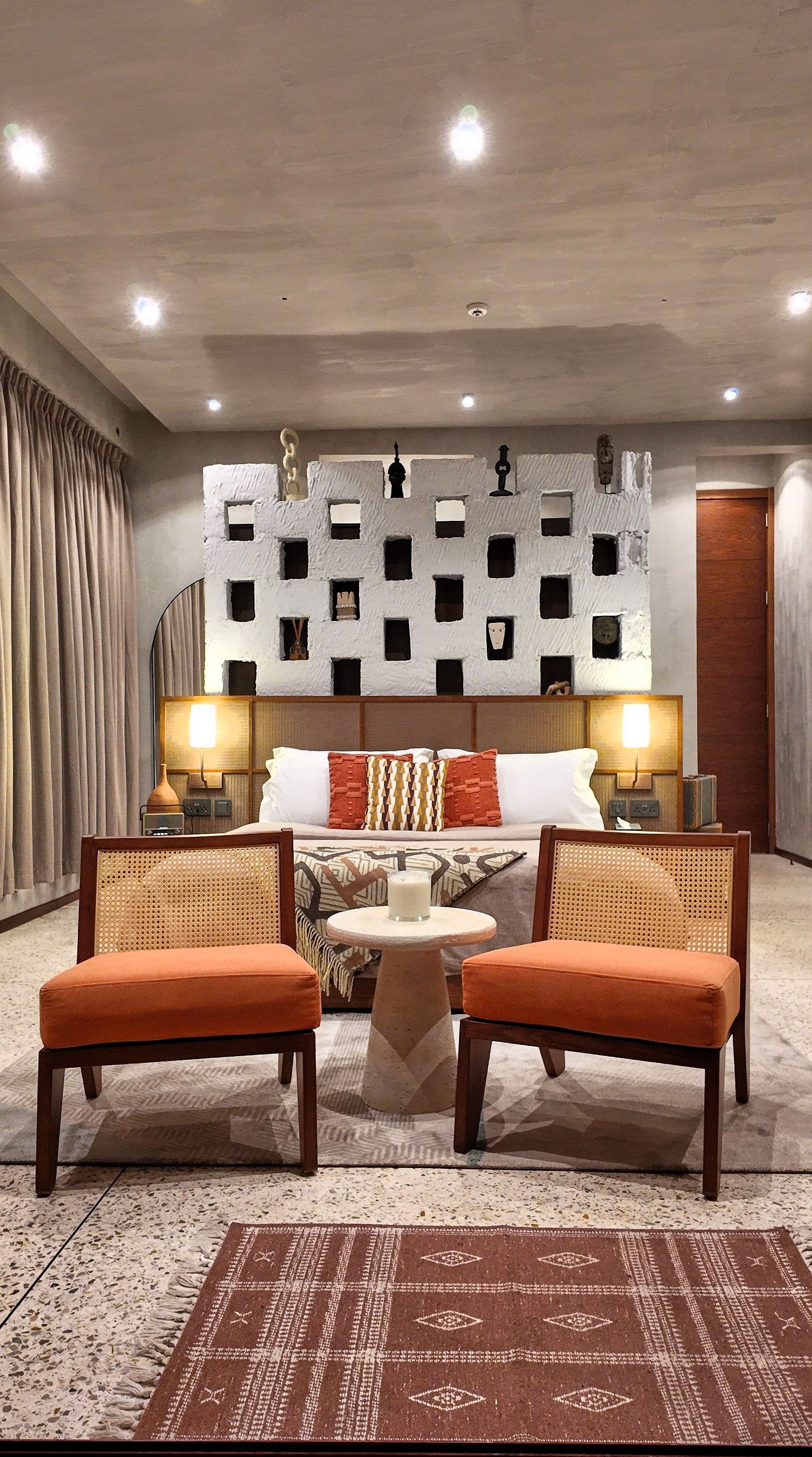 wide shot of bed and chairs