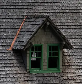 Restored dormer with new shingles