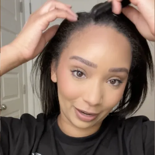 A african american influencer in the process of hair styling in the night time routine