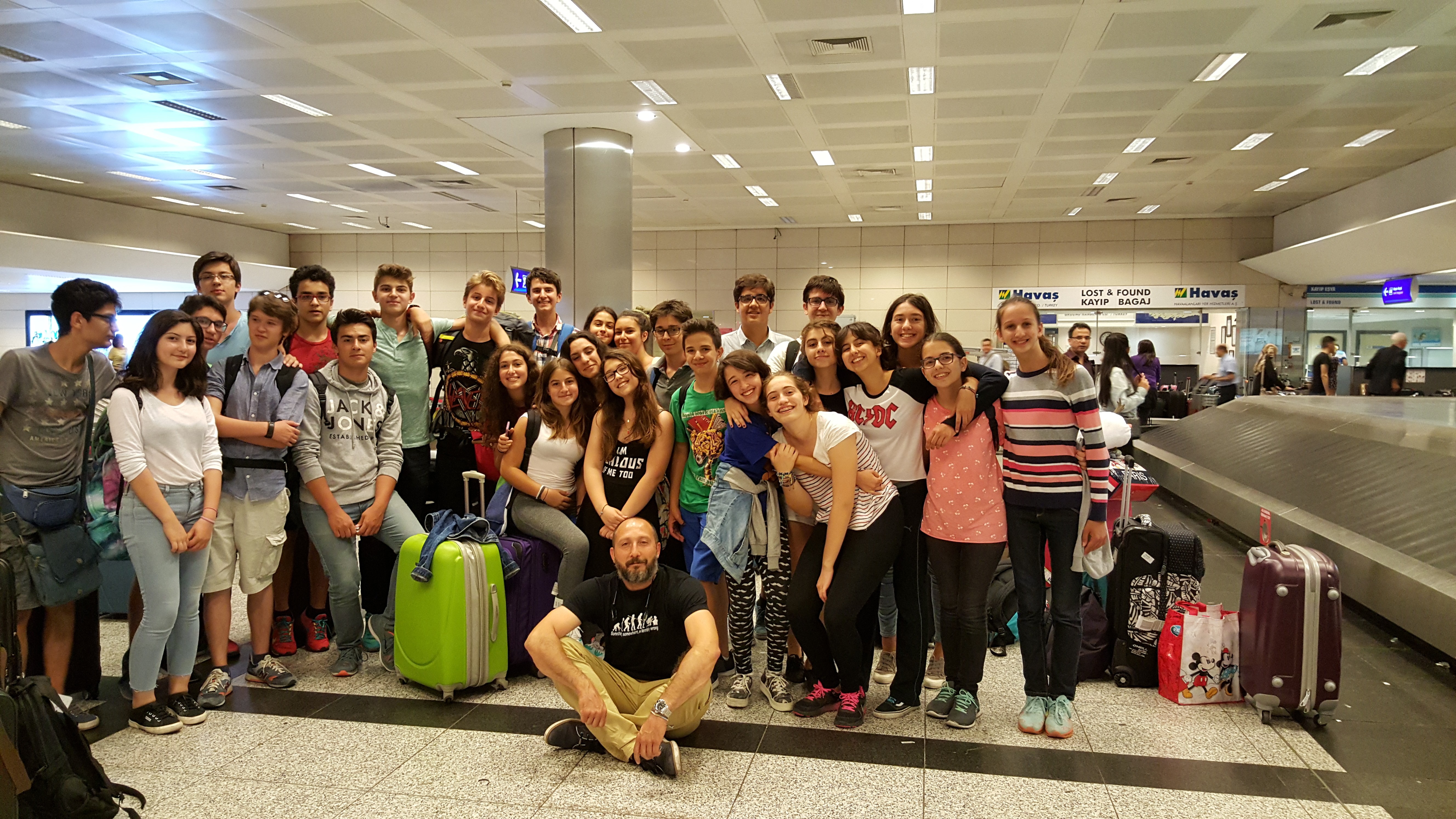 A person paddleboarding on a dark blue ocean.