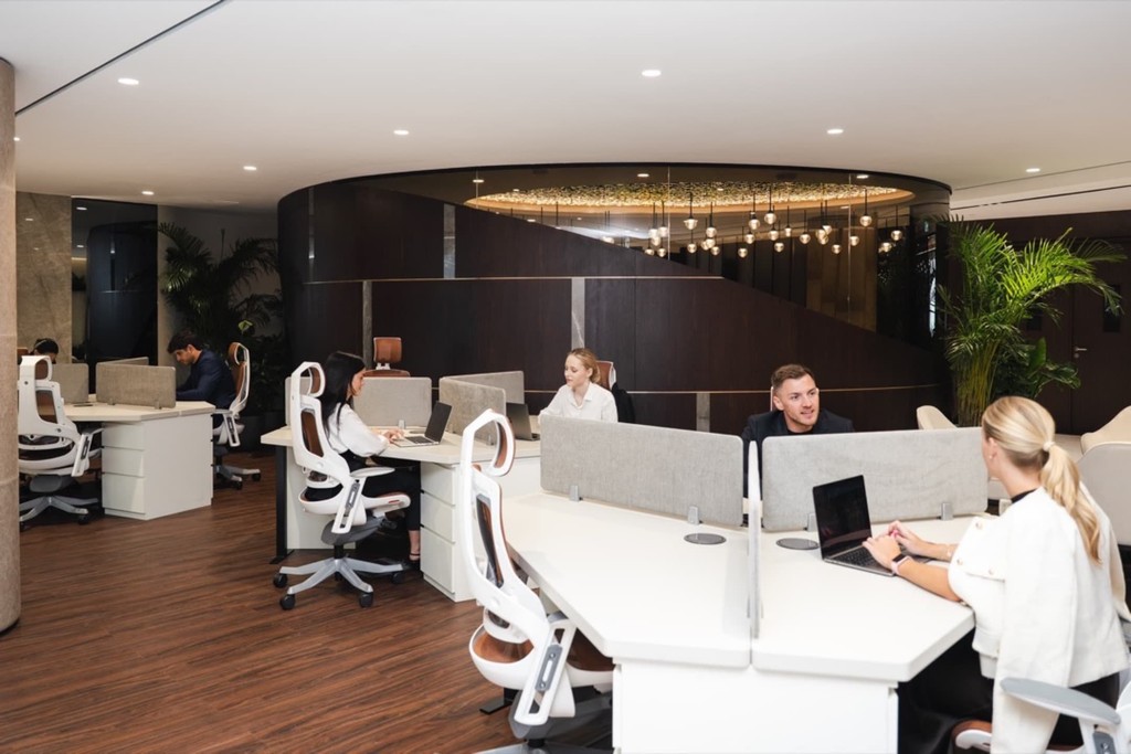 An innovative coworking space with networking-friendly communal areas and focus-friendly workstations.