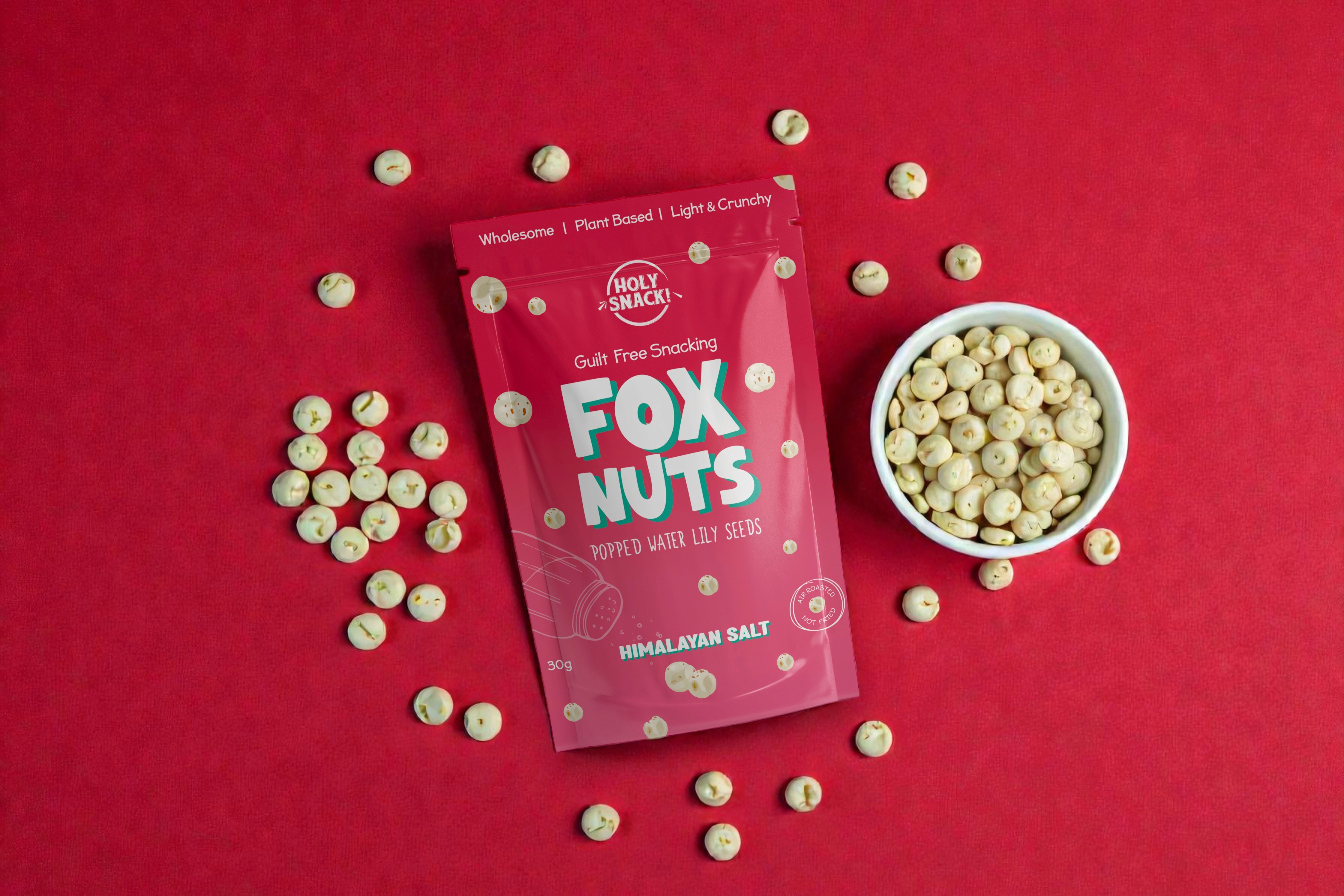 White branded cap with turquoise logo placed on fresh lemons in a red bowl
