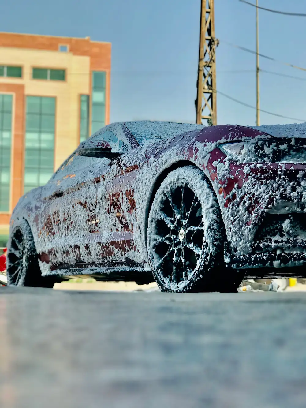 image of a car with soap suds falling off