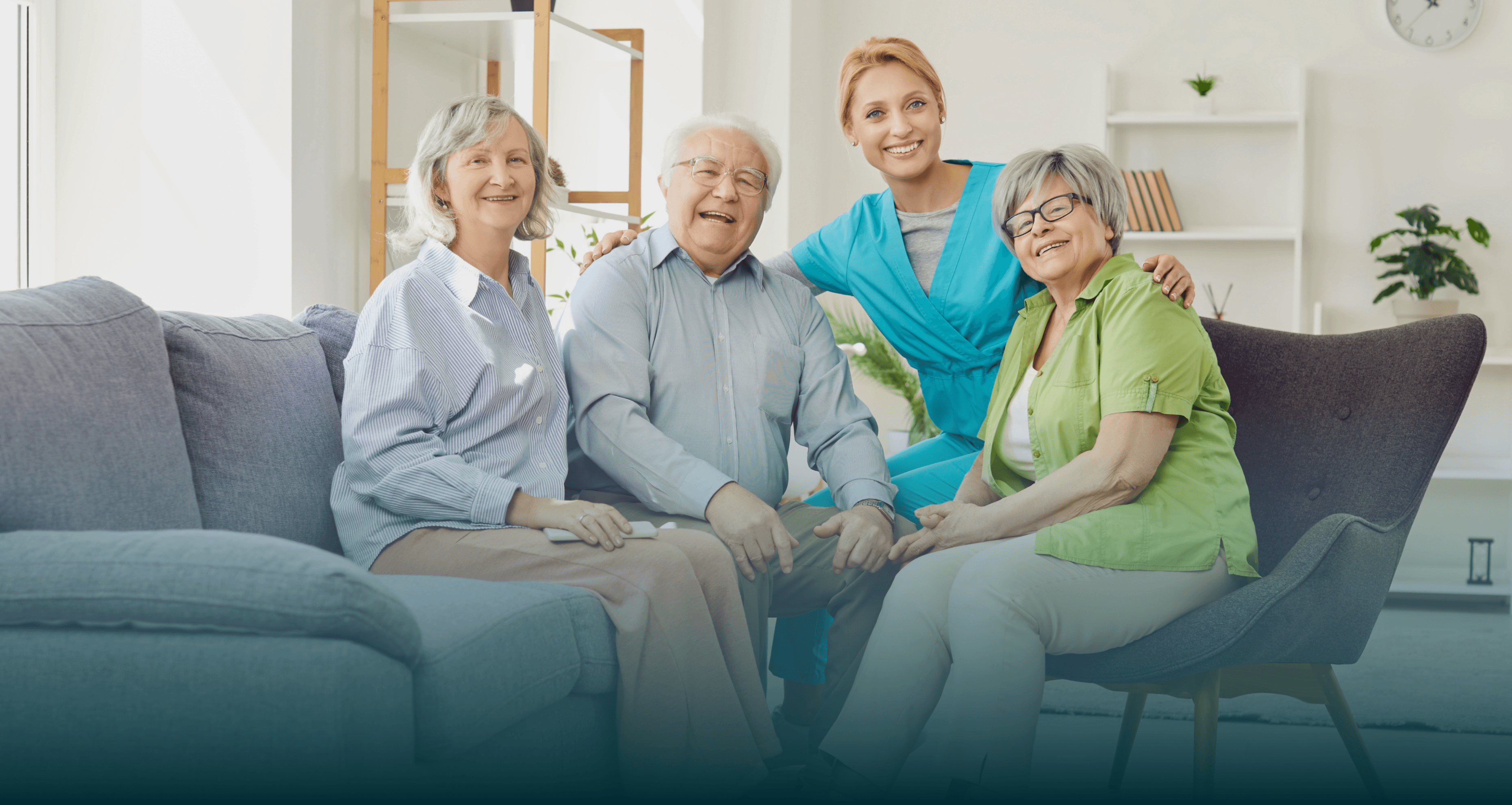 Friendly caregiver sitting with an elderly family.