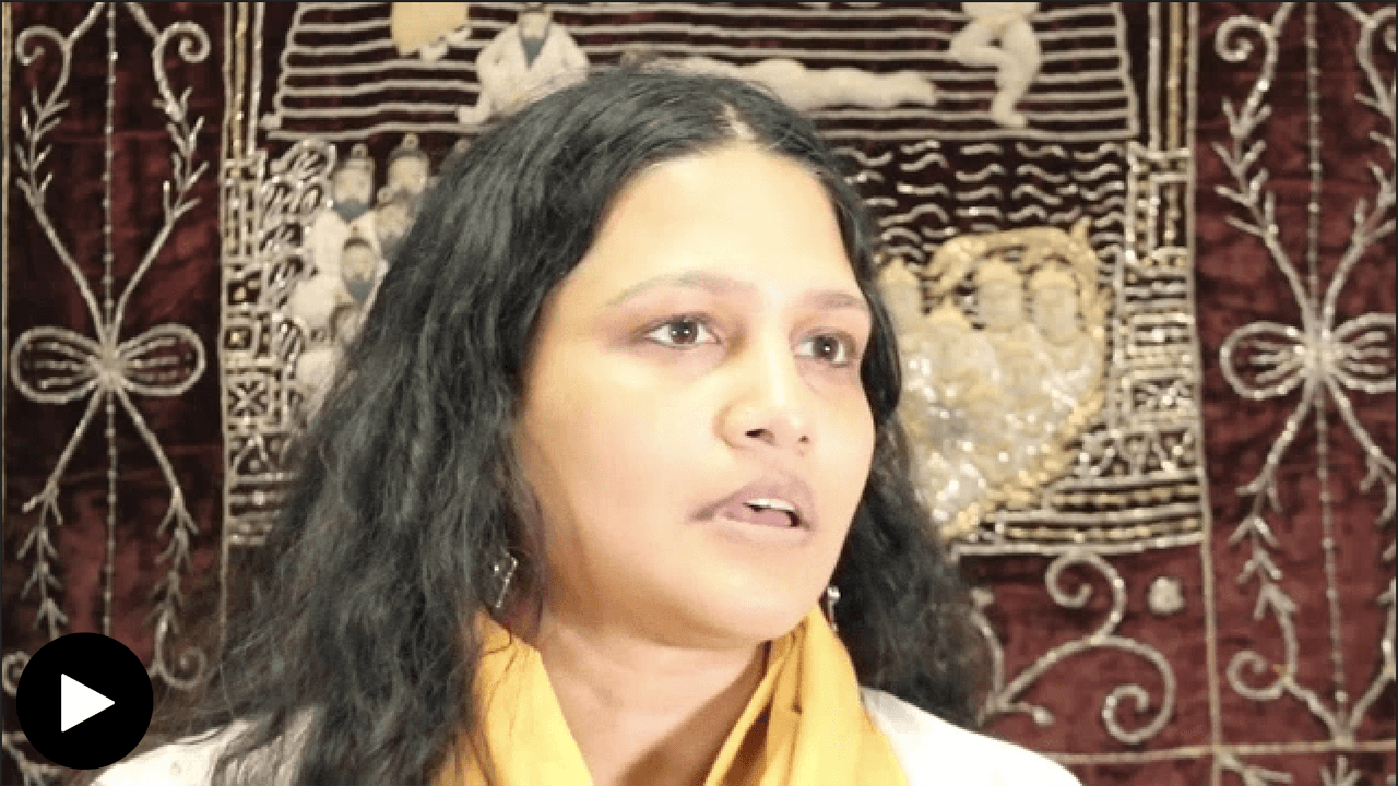 Dhanani (speaker) close up of face in front of chod pata